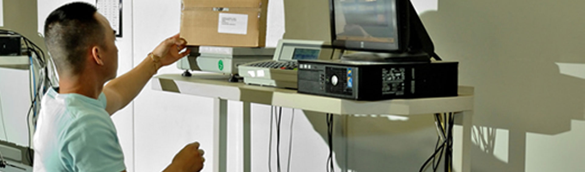 Weighing a package and affixing postage