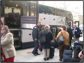 NIH Police clearing visitors as they board a bus for campus